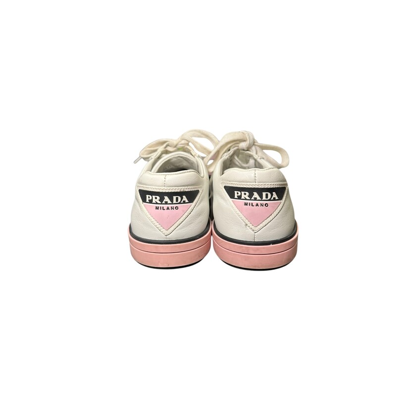 Prada Leather Low Top Shoes<br />
White & Pink<br />
Size: 38.5<br />
<br />
Style Code: 1E3471<br />
<br />
A few scuff throughout the shoe.<br />
<br />
Comes with an original dust bag no box.