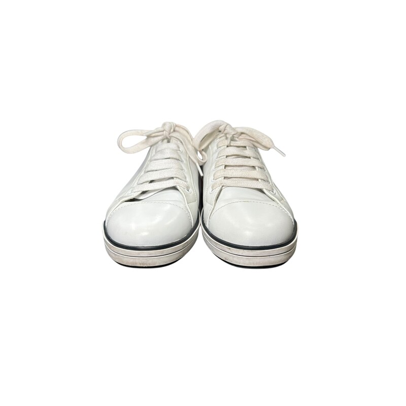 Prada Leather Low Top Shoes<br />
White & Pink<br />
Size: 38.5<br />
<br />
Style Code: 1E3471<br />
<br />
A few scuff throughout the shoe.<br />
<br />
Comes with an original dust bag no box.