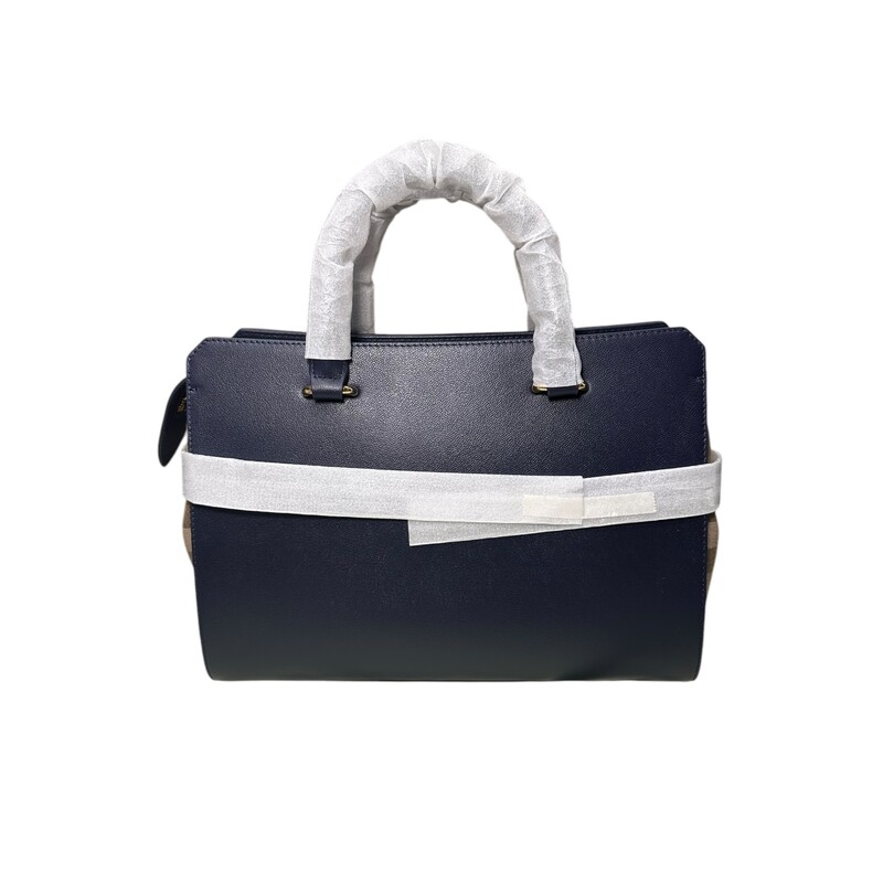 Burberry Banwell Tote<br />
Navy<br />
<br />
New With Tags<br />
<br />
Comes with the original dust bag but no box<br />
<br />
Dimensions: 13L x 9H<br />
<br />
Accessories: Comes with detachable long strap.