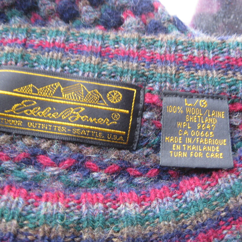 Vtg Eddie Bauer Wool, Navy, Size: Large<br />
Great for a guy or a gal, but probably made for a man.<br />
Eddie Bauer Shetland wool crewneck sweater was made in Thailand<br />
Blue Gray Green and red check  with a bit of tan in an overall check pattern<br />
<br />
It's a crew neck style with long sleeves.<br />
Marked size L<br />
Flat measurements<br />
Shoulder to shoulder: 24.25<br />
Armpit to Armpit: 25<br />
Waist: 18<br />
Overall length: 24.5<br />
Excellent condition! No flaws<br />
<br />
Thank you for looking<br />
#80730