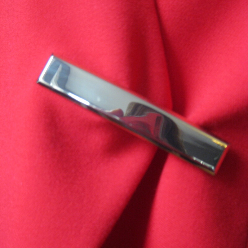 Calvin Klein, Red, Size: 4<br />
Sleek Calvin Klein Blazer with a novel touch.<br />
fitted red size 4 jacket with a gold bar closure.<br />
poly/rayon/spandex blend fabric,<br />
fully lined<br />
beautifully tailored.<br />
flat measurements:<br />
shoulder to shoulder: 14 3/8<br />
armpit to armpit: 17 1/2<br />
length: 24<br />
underarm sleeve seam: 17<br />
<br />
perfect condition, except!  the gold bar has tiny scratches.<br />
<br />
thanks for looking!<br />
#78146