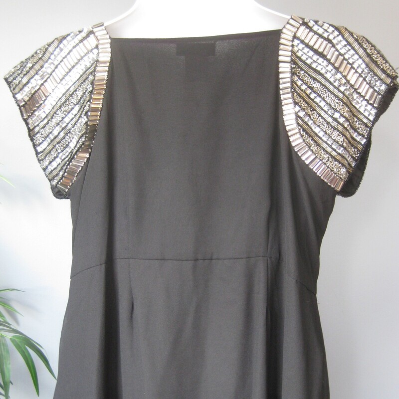 NWT Ulla Popken dress<br />
simle silhouette but with statement embellished shoulder.<br />
pretty and comfortable<br />
Comes with a little package of extra beads<br />
Sheer chiffon layer over an underlayer.<br />
high wasted, gathered skirt.<br />
marked size 16/18<br />
here are the flat meausurements:<br />
armpit to armpit: 22.25<br />
waist: 21.5, measured at the empire waist height seam between the bodice and the skirt<br />
hip: up to 28, should be free and loose from the waist down.<br />
length: 51.5<br />
<br />
brand new!<br />
thanks for looking!<br />
#78144