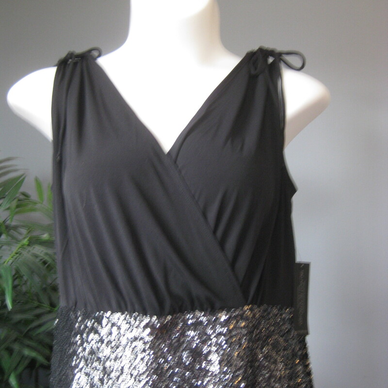 NWT Lane Branyt Sequin Ta, Black, Size: XL<br />
Attention grabbing but elegant bodycon dress by Lane Bryant<br />
New with tags.<br />
<br />
Sleeveless surplice v neck bodice and spakling sequined pencil style skirt.<br />
<br />
marked size 16<br />
Flat measurements: taken with the garment lying flat and unstretched.<br />
armpit to armpit: 20<br />
waist area: aprox 18<br />
hip area: aprox 22.5<br />
length: 45<br />
<br />
Pls note, I have this same dress marked size 18, also NWT.  Please see it here if you'd like to check those measurements and get the best fit for your body.<br />
https://www.mercari.com/us/item/m45567461843/<br />
<br />
thanks for looking!'<br />
#73173