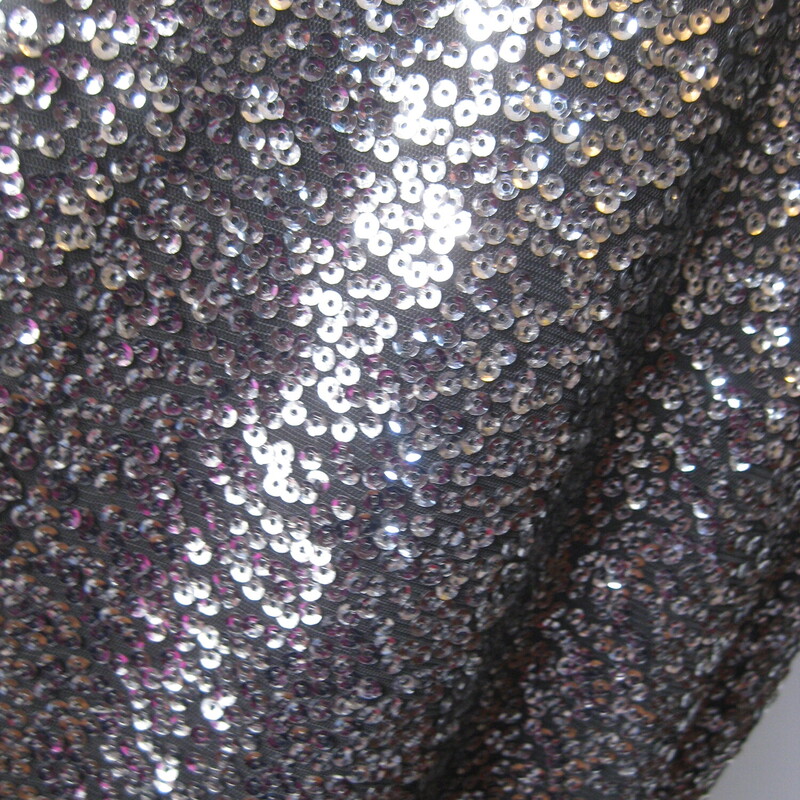 NWT Lane Branyt Sequin Ta, Black, Size: XL<br />
Attention grabbing but elegant bodycon dress by Lane Bryant<br />
New with tags.<br />
<br />
Sleeveless surplice v neck bodice and spakling sequined pencil style skirt.<br />
<br />
marked size 16<br />
Flat measurements: taken with the garment lying flat and unstretched.<br />
armpit to armpit: 20<br />
waist area: aprox 18<br />
hip area: aprox 22.5<br />
length: 45<br />
<br />
Pls note, I have this same dress marked size 18, also NWT.  Please see it here if you'd like to check those measurements and get the best fit for your body.<br />
https://www.mercari.com/us/item/m45567461843/<br />
<br />
thanks for looking!'<br />
#73173