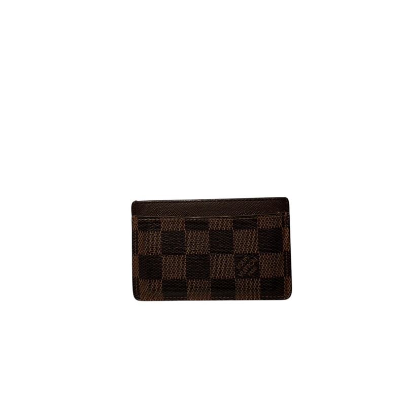 Louis Vuitton Damier Ebene Card Holder<br />
<br />
Date Code: Microchip.<br />
<br />
Dimensions:<br />
4.3 x 2.8 x 0.2 inches<br />
(Length x Height x Width)<br />
<br />
Does not come with original box or dust bag.<br />
<br />
Good Condition: Some warping of the leather and wear around the edges and corners.