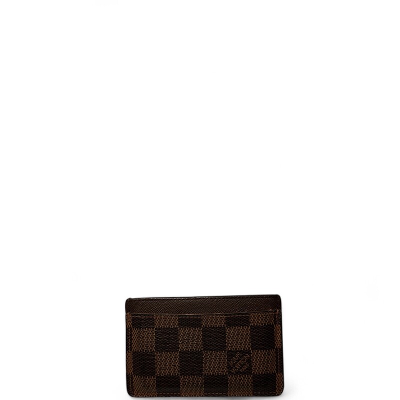 Louis Vuitton Damier Ebene Card Holder

Date Code: Microchip.

Dimensions:
4.3 x 2.8 x 0.2 inches
(Length x Height x Width)

Does not come with original box or dust bag.

Good Condition: Some warping of the leather and wear around the edges and corners.