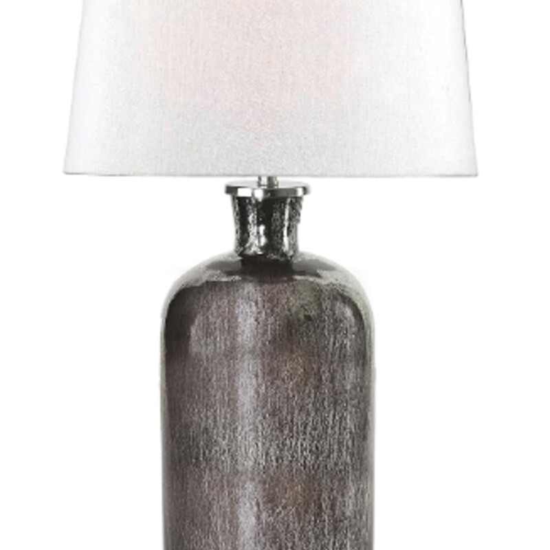 Kenroy Acid Mercury Lamp
Silver Black with Cream Shade
Size: 16x16.5H
With its unique acid mercury finish, the Asher table lamp makes a fantastic inspirations piece for a transitional bedroom or living room. The jugular shaped based sits distressed while supporting a 16-inch clean white tapered drum shade, the perfect balance of calm and eye catching boldness.
AS IS- Stain interior Shade
Coordinating Lamp with different shade Sold Separately