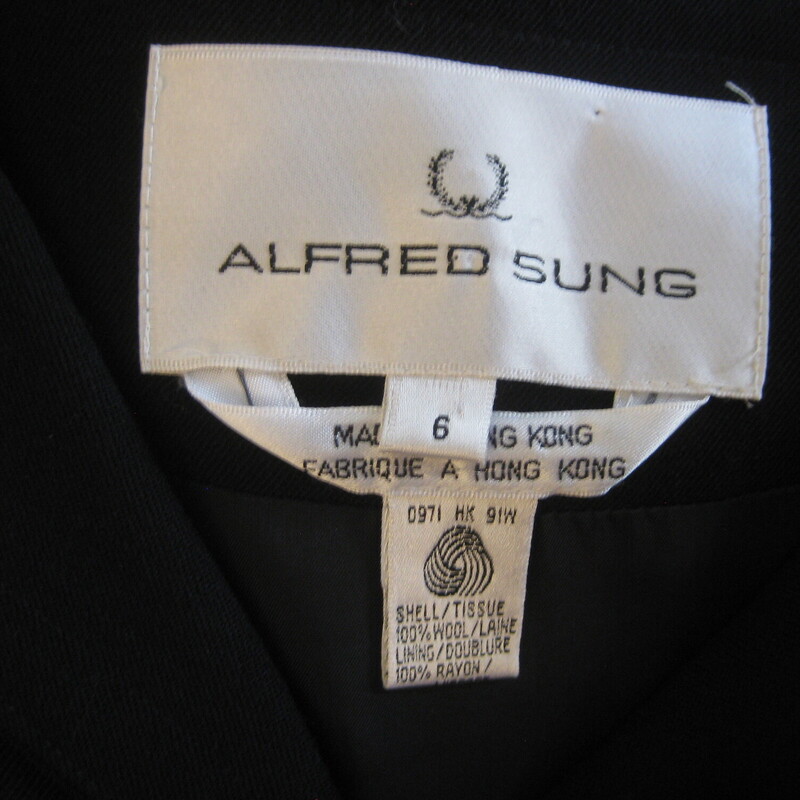 Vtg Alfred Sung Wool, Black, Size: 6<br />
Simple black wool dress by Alfred Sung.<br />
Buttons open to the waist with two chest pockets and long sleeves.<br />
Slightly dropped shoulders with soft shoulder pads<br />
Made in Hong Kong<br />
Marked size 6, pls use these flat measurements to be sure it will fit your body<br />
Shoulder to shoulder: 18.5 the shoulder seam will probably hit a little below your shoulder point by design.<br />
Armpit to Armpit: 20<br />
Waist area: 16.25<br />
Hips: 19.5<br />
Length: 40.5<br />
underarm sleeves seam: 17.5<br />
Thank you for looking<br />
#75418