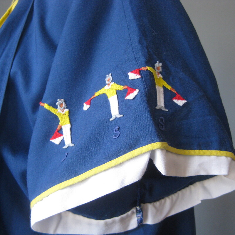 Super interesting night gown and robe set.<br />
Very lightweight blue cotton blend embroidered set made in Italy by<br />
Malizia.<br />
The robe has short sleeves each one embroidered with semaphore bearing sailors spelling out the word kiss.<br />
The nightgown has the sailors embroidered on the front and it has a keyhole like neckline outlined in yellow.<br />
Pretty and presentable, packs easily for travel when necessary.<br />
Excellent vintage condition.<br />
No size tag.<br />
the night gown measures 19.5 flat at the armpit, 20 across at the waist, 21.5 at the hip and it's 43.25 in length<br />
<br />
thanks for looking!<br />
#77674