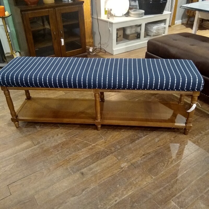 Upholstered Bench W/Shelf

Very sturdy dark blue upholstered bench with a wood frame.  Bench has a bottom shelf.

Size: 58 in wide X 15 in deep X 20 in high