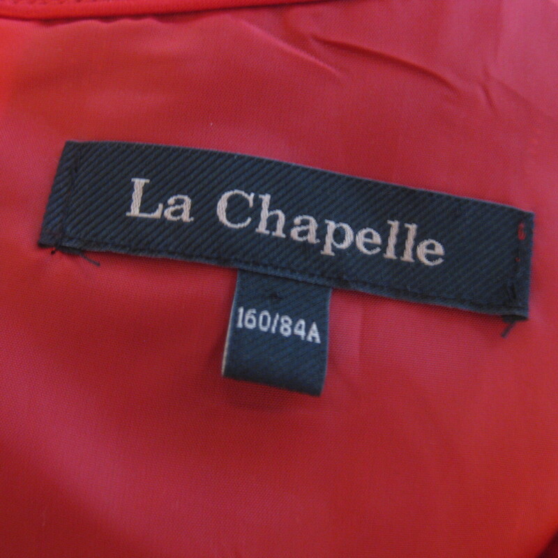 La Chapelle Satin Ribbon, Red, Size: XS<br />
Sweet and sassy little party dress in red satin.<br />
Sleevless with a full skirt and a little bow at the neck<br />
Fully lined. Center back invisible zipper<br />
The fabric has lots of body, as you can see.<br />
It doesn't have a size tag.<br />
Quite small, and cut for a junior body.<br />
here are the flat measurements:<br />
rmpit to armpit: 17.25<br />
waist: 16<br />
hip: free<br />
length: 30<br />
<br />
thanks for looking!<br />
#76844