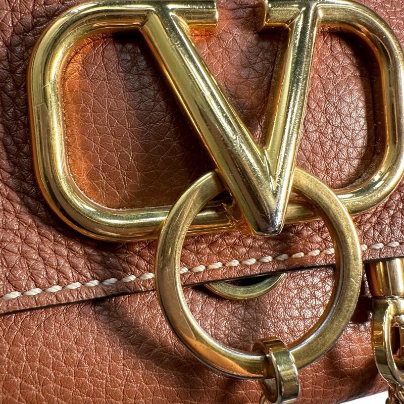 Valentino V Ring Flap Calfskin Crossbody<br />
<br />
Dimensions:<br />
10L X 6.5H<br />
16  strap drop<br />
<br />
Very Good condition. Some minor marks on hardware.<br />
<br />
<br />
Does not come with the original dust bag or box.