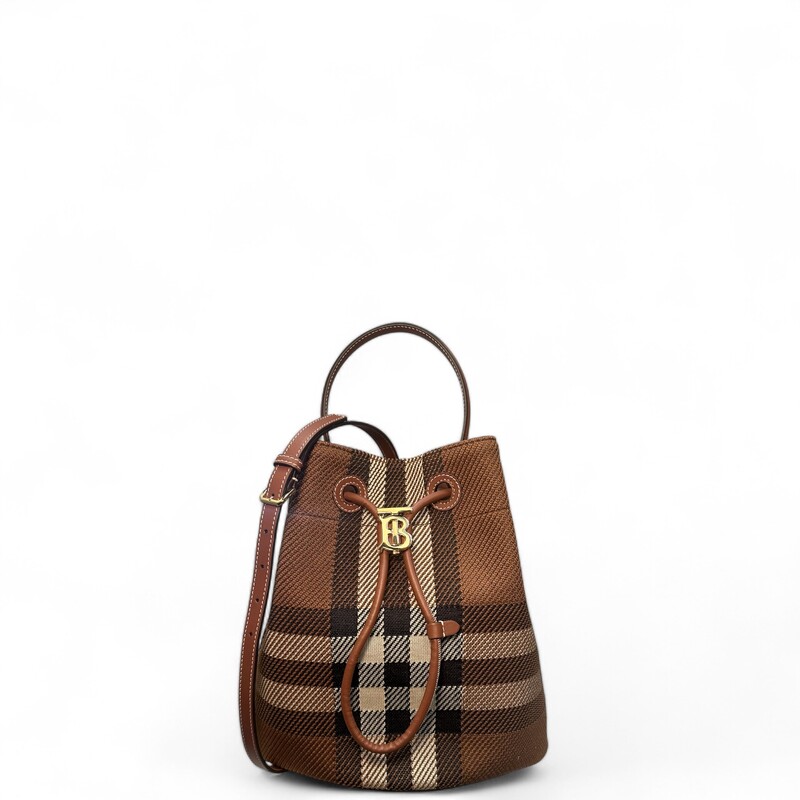 Burberry TB Brown Small Knit Check

Material: fabric with leather trim
Interior Material: Canvas Plain
Hardware Color: Gold

Place of Origin: UK

Product Features:
Removable Strap
Adjustable Strap
Drawstring Closure

Condition: Like new.
Accessories: Dust Bag,
Measurements: Height 11, Width 10.5, Depth 6.5

Serial #TIVITP1262