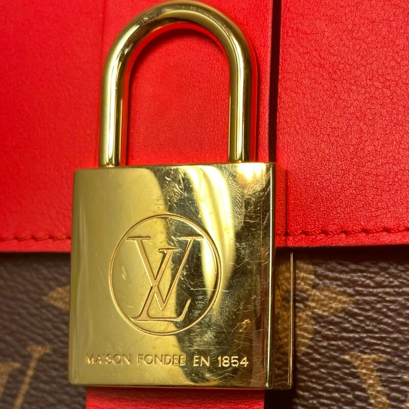 Louis Vuitton Locky BB Red Handbag<br />
<br />
Date Code: AA0280<br />
<br />
Dimensions:<br />
7.9 x 6.3 x 3 inches<br />
(Length x Height x Width)<br />
<br />
In very condition. Scratching to the lock and light wear to the canvas.<br />
<br />
Comes with original dust bag. No box.