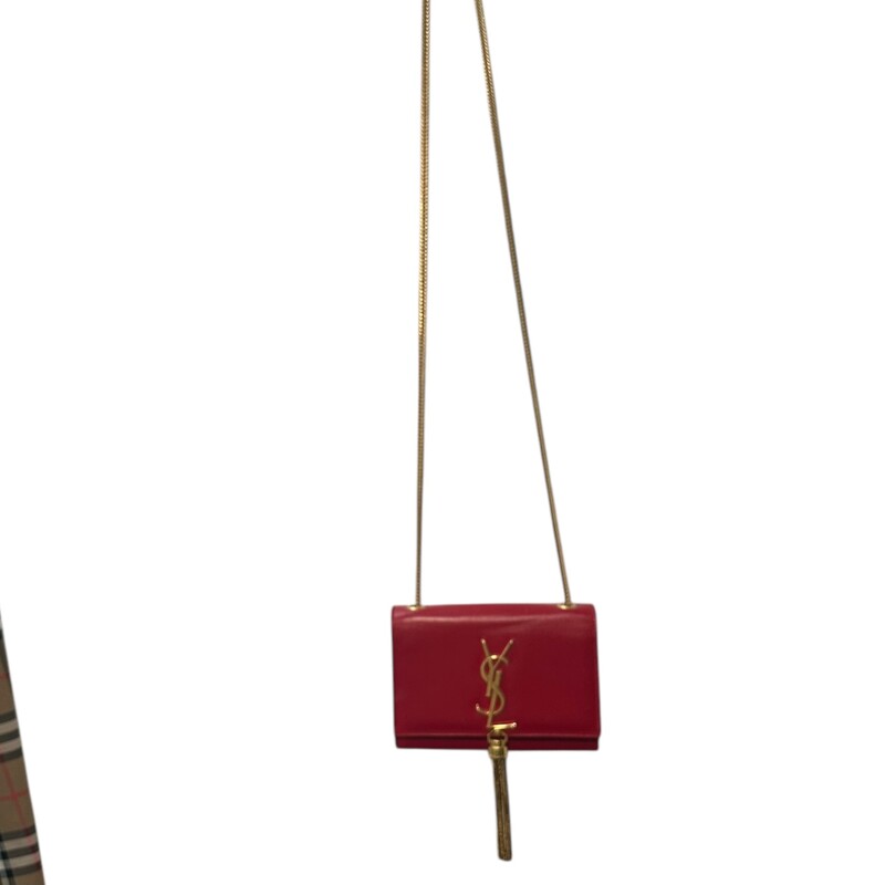 YSL Kate Tassel Red Crossbody<br />
<br />
Date Code:326076 496395<br />
<br />
Dimensions:<br />
6.5in x 5in x 1.5in<br />
<br />
In good condition. Light scratching to the leather and to the corners. Light wear to the interior.<br />
<br />
Comes with original dust bag. No box.