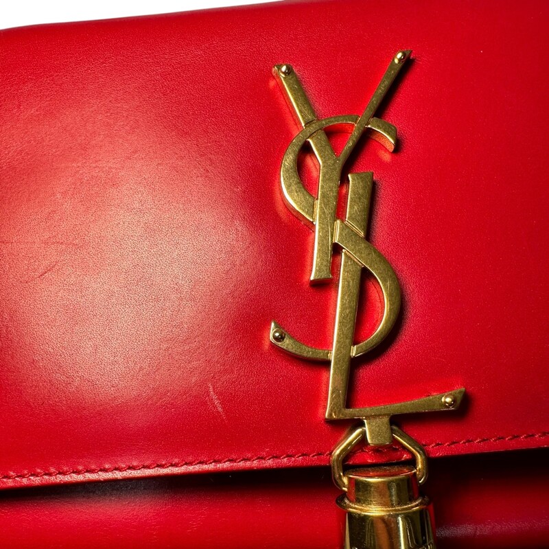 YSL Kate Tassel Red Crossbody<br />
<br />
Date Code:326076 496395<br />
<br />
Dimensions:<br />
6.5in x 5in x 1.5in<br />
<br />
In good condition. Light scratching to the leather and to the corners. Light wear to the interior.<br />
<br />
Comes with original dust bag. No box.