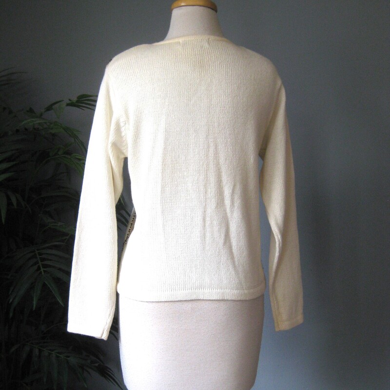 HI Sweater Girl, This adorable sweater from the 80s or early 90s in cream and gold features beads, 'jewels' and lurex. Great for the holidays<br />
It's from Dress Barn...... cringe? no. cute.<br />
round gold buttons and little shoulder pads.<br />
Plain on the back<br />
Excellent condition.<br />
cotton ramie blend<br />
Size S with some stretch<br />
Flat measurements, please double where appropriate:<br />
Shoulder to Shoulder: 15.5<br />
Armpit to Armpit: 19<br />
Width at bottom: 16<br />
length: 20.5<br />
Underarm sleeve seam length: 18.5<br />
<br />
Thanks for looking!<br />
#77676