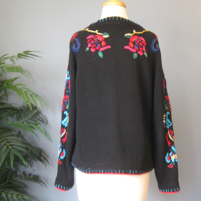 Chunky, colorful, warm  cardigan sweater by Gantos<br />
It's black with bold yarn embroidery dotted with metallic round beads<br />
The yarn covered buttons on the outside are decorative, inside the front edge are easy to work with small black plastic buttons.<br />
The front, sleeves and shoulders are decorated.<br />
Marked size small but should fit a modern medium as well<br />
flat measurements:<br />
armpit to armpit: 21<br />
width at hem: 21<br />
length: 21<br />
<br />
Excellent condition no flaws<br />
thanks for looking!<br />
#77507