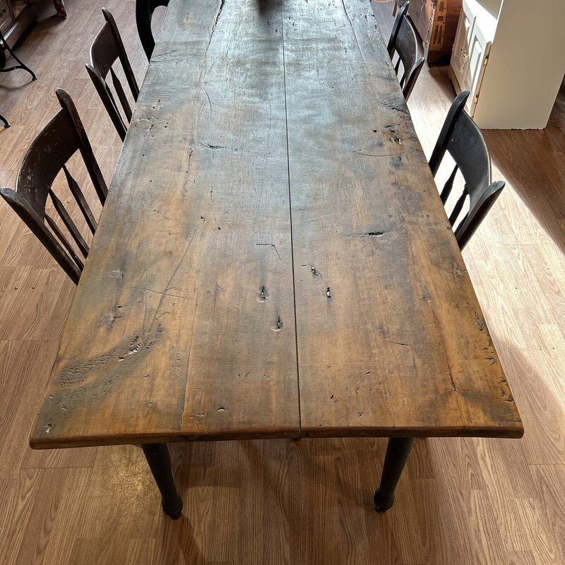 Antique Door Farm Table,<br />
Size: 72x29x30<br />
This gorgeous farm table appears to have been made from 2 doors.   The hinge marks are visible on the edges of the table top.  The base is more modern in age but blends beautifully with the top.  It has already received lots of ooohs and ahhhs at the shop; the pictures do not do it justice. There are 4 chairs that came in with it but are being sold separately.