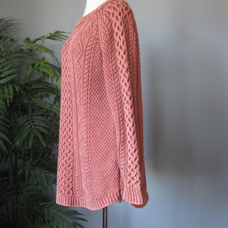 Very high quality cotton cable knit pullover sweater from LL Bean.<br />
In a dusty soft salmon pink with high relief cable pattern.<br />
neck is boat neck<br />
zippers at each side at the hem.<br />
<br />
Size Large<br />
flat measurements:<br />
armpit to armpit: 19.75<br />
width at hem with zippers zipped: 21.5<br />
length: 28<br />
underarm sleeve length: 19<br />
<br />
excellent like new condition.<br />
thanks for looking!<br />
#82811