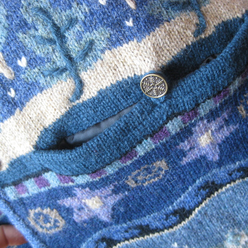 Gorgeous Icelandic Design winter sweater jacket<br />
100% wool and lined so you can wear this outside on milder winter days.<br />
Pretty blue winter landscape patterns with trees and snow falling.<br />
Zip Front<br />
metal decorative buttons<br />
pockets<br />
Size XL<br />
flat measurements:<br />
shoulder to shoulder : 21<br />
armpit to armpit: 18.5<br />
waist area: aprox 16<br />
width at hem when zipped: 19<br />
length: 24<br />
underarm sleeve length: 17<br />
<br />
like new condition, thanks for looking!<br />
#80828