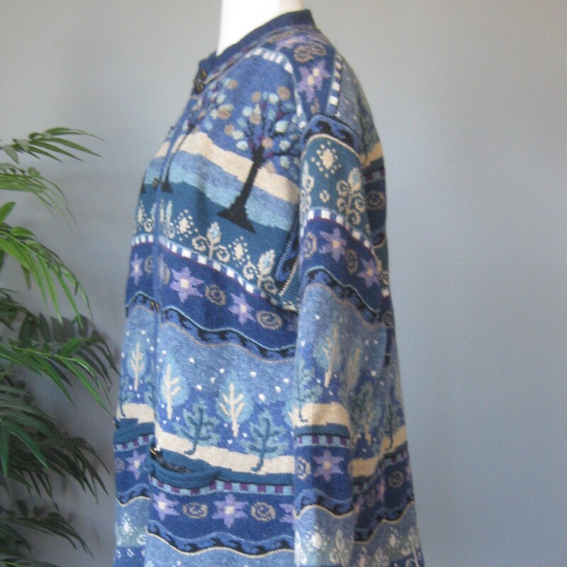 Gorgeous Icelandic Design winter sweater jacket<br />
100% wool and lined so you can wear this outside on milder winter days.<br />
Pretty blue winter landscape patterns with trees and snow falling.<br />
Zip Front<br />
metal decorative buttons<br />
pockets<br />
Size XL<br />
flat measurements:<br />
shoulder to shoulder : 21<br />
armpit to armpit: 18.5<br />
waist area: aprox 16<br />
width at hem when zipped: 19<br />
length: 24<br />
underarm sleeve length: 17<br />
<br />
like new condition, thanks for looking!<br />
#80828