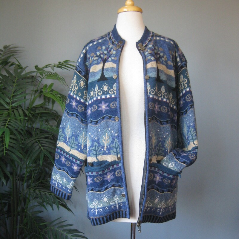 Gorgeous Icelandic Design winter sweater jacket<br />
100% wool and lined so you can wear this outside on milder winter days.<br />
Pretty blue winter landscape patterns with trees and snow falling.<br />
Zip Front<br />
metal decorative buttons<br />
pockets<br />
Size XL<br />
flat measurements:<br />
shoulder to shoulder : 21<br />
armpit to armpit: 18.5<br />
waist area: aprox 16<br />
width at hem when zipped: 19<br />
length: 24<br />
underarm sleeve length: 17<br />
<br />
like new condition, thanks for looking!<br />
#80828