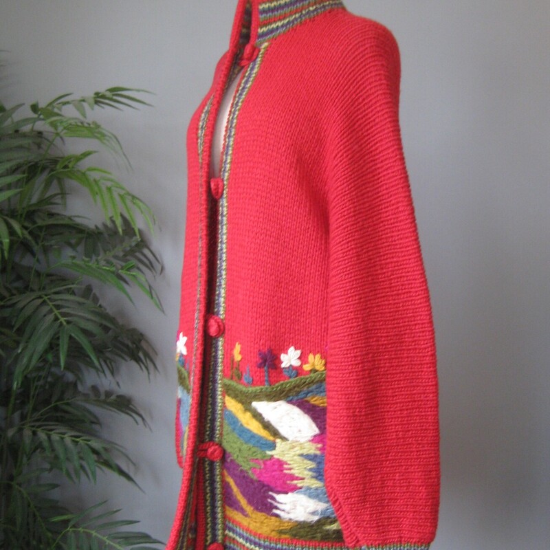 Vtg Wool ? Scenic CCozy Vintage Handmade cardigan sweater<br />
Red with pretty yarn embroidery all around the hem.<br />
It was made for my consignor years ago.<br />
No tags, but I believe it's nice acrylic or maybe even wool<br />
Button and loop closures<br />
Should fit a modern size 3X<br />
flat measurements:<br />
armpit to armpit: 28<br />
length: 33<br />
Great vintage condition.  the yarn embroidery has developed a bit of nap as shown in the close photo.<br />
thanks for looking!<br />
#81164ardiga, Red, Size: XL