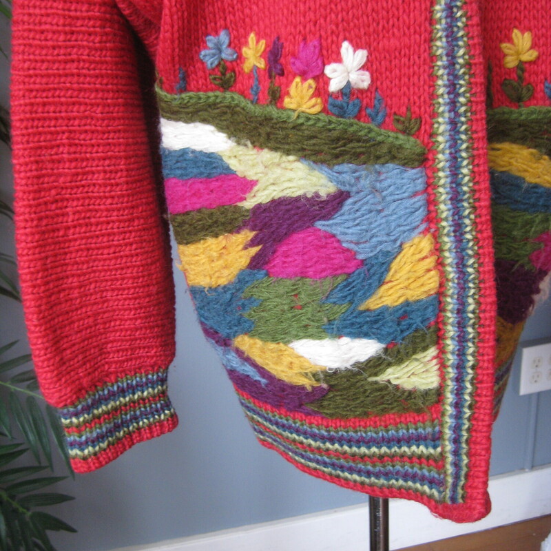 Vtg Wool ? Scenic CCozy Vintage Handmade cardigan sweater<br />
Red with pretty yarn embroidery all around the hem.<br />
It was made for my consignor years ago.<br />
No tags, but I believe it's nice acrylic or maybe even wool<br />
Button and loop closures<br />
Should fit a modern size 3X<br />
flat measurements:<br />
armpit to armpit: 28<br />
length: 33<br />
Great vintage condition.  the yarn embroidery has developed a bit of nap as shown in the close photo.<br />
thanks for looking!<br />
#81164ardiga, Red, Size: XL