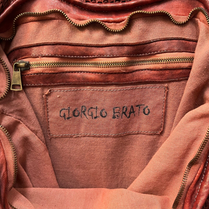 Giorgio Brato Foldover Tote/ Crossbody Handbag<br />
Now Trending!! Strikingly casual, strappy and gorgeous! This is, Giorgio Brato, in Bordeaux. Noteable, high quality Italian leather! Large, yet light, roomy for on flight! Take it and set off on an adventure!<br />
Missing crossbody strap, we have added a new one included with purchase<br />
One zippered inside pocket<br />
Now this is a bag!<br />
Width: 16.5 inches<br />
Length: 31inches<br />
Handle Drop: 8 inches