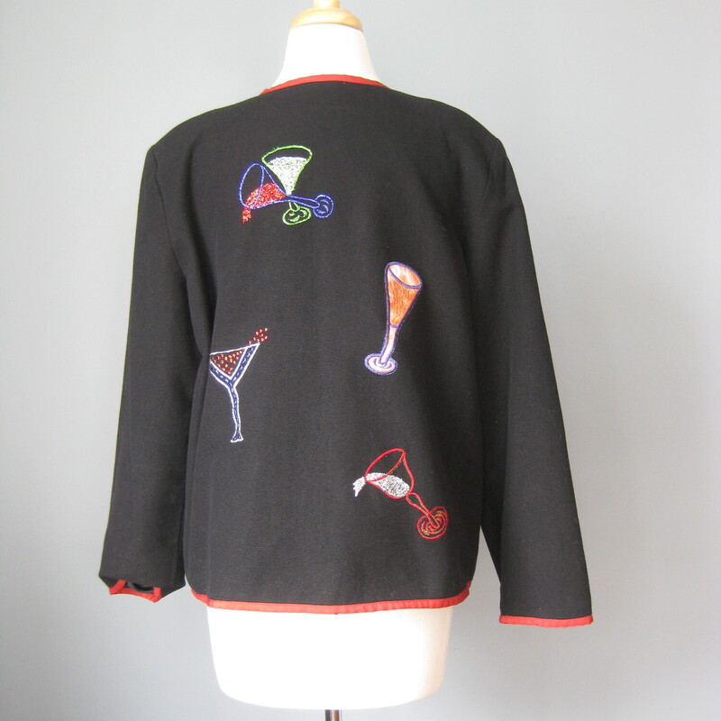 Nice jacket to wear on New Years Eve !<br />
High quality medium weight cotton with colorful barware and drinks embroidered all over it.<br />
Trimmed in red edging<br />
The embellishements continue on the back of the jacket and the sleeves<br />
Pretty blue plastic beads and loops down the front.<br />
Fully lined in polyester<br />
by Daniel K , Made in India<br />
Marked size LK<br />
<br />
Flat measurements:<br />
shoulder to shoulder: 17.5<br />
armpit to armpit: 22.75<br />
width at hem while buttoned: 23<br />
length: 25.75<br />
underarm sleeve seam: 17.25<br />
<br />
thanks for looking!<br />
#41870