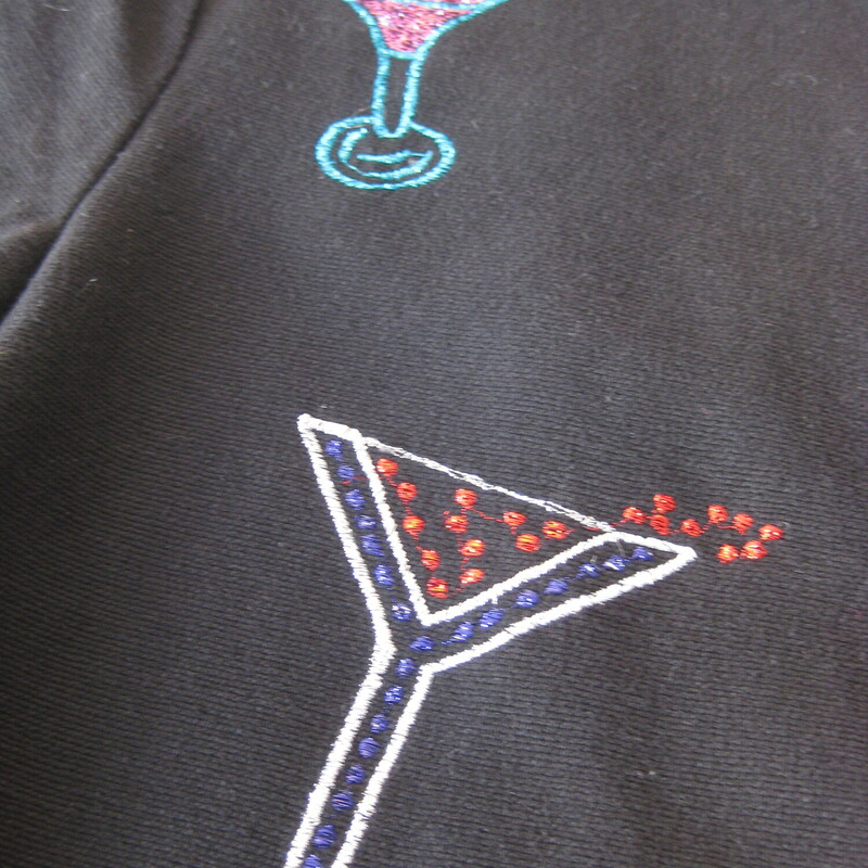 Nice jacket to wear on New Years Eve !<br />
High quality medium weight cotton with colorful barware and drinks embroidered all over it.<br />
Trimmed in red edging<br />
The embellishements continue on the back of the jacket and the sleeves<br />
Pretty blue plastic beads and loops down the front.<br />
Fully lined in polyester<br />
by Daniel K , Made in India<br />
Marked size LK<br />
<br />
Flat measurements:<br />
shoulder to shoulder: 17.5<br />
armpit to armpit: 22.75<br />
width at hem while buttoned: 23<br />
length: 25.75<br />
underarm sleeve seam: 17.25<br />
<br />
thanks for looking!<br />
#41870