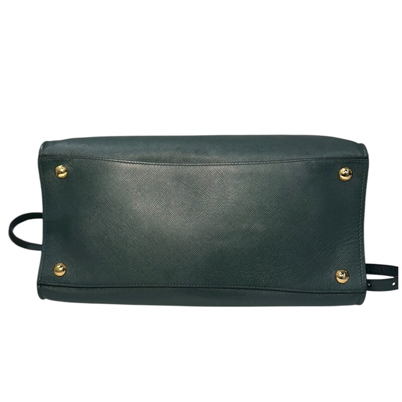 Prada Triple Pocket Green Leather Handbag with detachable strap.<br />
<br />
Factory Code:11/113<br />
<br />
Dimensions: 13Lx10H<br />
<br />
Very good condition. Some slight corner slouching.<br />
<br />
Does not come with original box or dust bag.