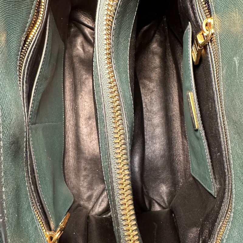 Prada Triple Pocket Green Leather Handbag with detachable strap.<br />
<br />
Factory Code:11/113<br />
<br />
Dimensions: 13Lx10H<br />
<br />
Very good condition. Some slight corner slouching.<br />
<br />
Does not come with original box or dust bag.