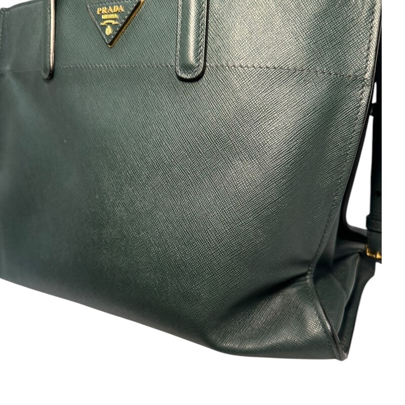 Prada Triple Pocket Green Leather Handbag with detachable strap.<br />
<br />
Factory Code:11/113<br />
<br />
Dimensions: 13Lx10H<br />
<br />
Very good condition. Some slight corner slouching.<br />
<br />
Does not come with original box or dust bag.