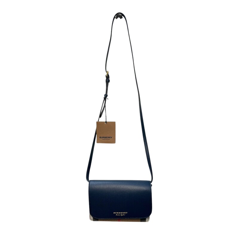 Burberry Hampshire Derby<br />
<br />
Burberry Hampshire Derby New With Tags<br />
<br />
Measurements: 7.5 L x 1.5 W x 5.15 H<br />
Navy Leather<br />
Interior Pockets: Six card slots, two flat pockets and one zip pocket<br />
Exterior Pockets: One rear flat pocket<br />
Handles: Single flat adjustable leather shoulder strap<br />
Handle Drop: 21 adjustable<br />
Closure/Opening: Flap top with magnetic snap closure<br />
Interior Lining: Leather lining<br />
Hardware: Goldtone<br />
<br />
Comes with original dust bag. No box.