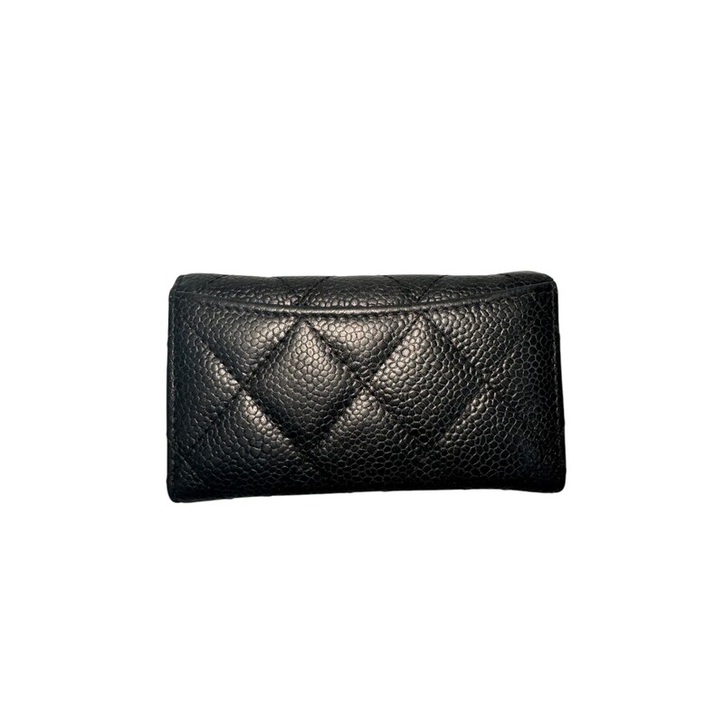 Chanel Black Timeless Caviar Key Holder With Exterior Back Pocket<br />
<br />
Date Code: 19360652<br />
<br />
Dimensions:<br />
L 4 in x W  0.25 in x H 2.5 in<br />
<br />
Good condition. Some interior marks and scratching of the interior leather.<br />
<br />
Does not come with the original dust bag or box.