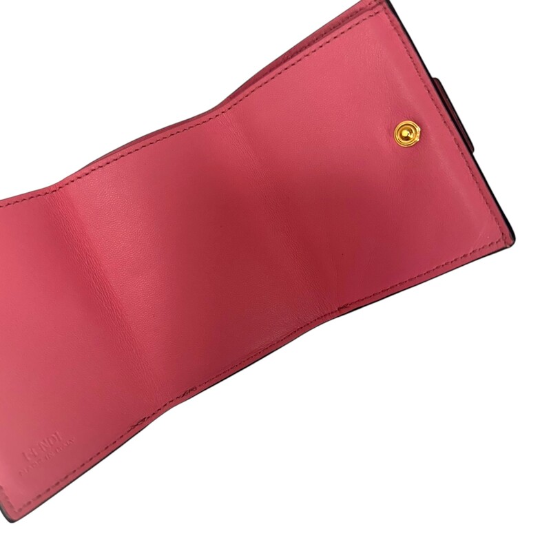 Fendi Baguette Micro Zucca Tri-fold Nappa<br />
<br />
Leather  Pink Wallet<br />
<br />
Serial Code: 8M0395-AAID-218-108<br />
<br />
Dimensions:<br />
Length: 4.33in<br />
Height:3.14in<br />
Depth:.98in<br />
<br />
In very good condition. Some scratching of the hardware light wear to the leather.<br />
<br />
Does not come with the original dust bag or box.