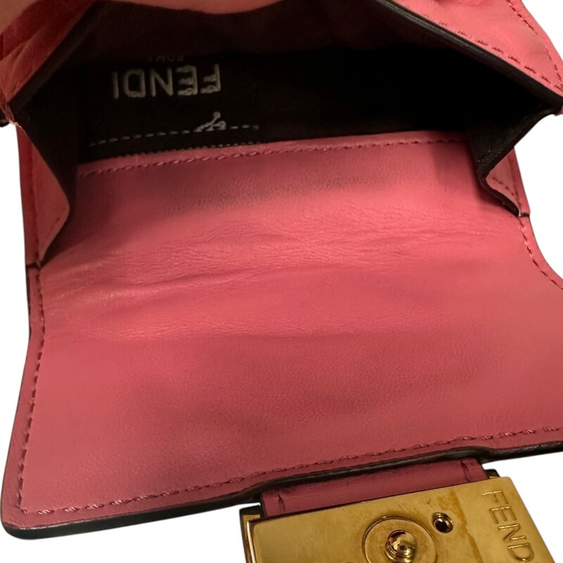 Fendi Baguette Micro Zucca Tri-fold Nappa

Leather  Pink Wallet

Serial Code: 8M0395-AAID-218-108

Dimensions:
Length: 4.33in
Height:3.14in
Depth:.98in

In very good condition. Some scratching of the hardware light wear to the leather.

Does not come with the original dust bag or box.