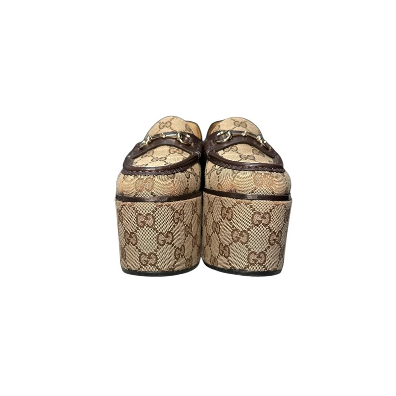 Gucci Brown Monogram Horsebit Platform Loafers<br />
<br />
Size 38.5<br />
<br />
Style Code:5786009 04Z<br />
<br />
Heel Height: 4 Wedge Platform<br />
<br />
Very good condition. Some very minor wear on bottoms.<br />
<br />
Comes with the original dust bag. No box.