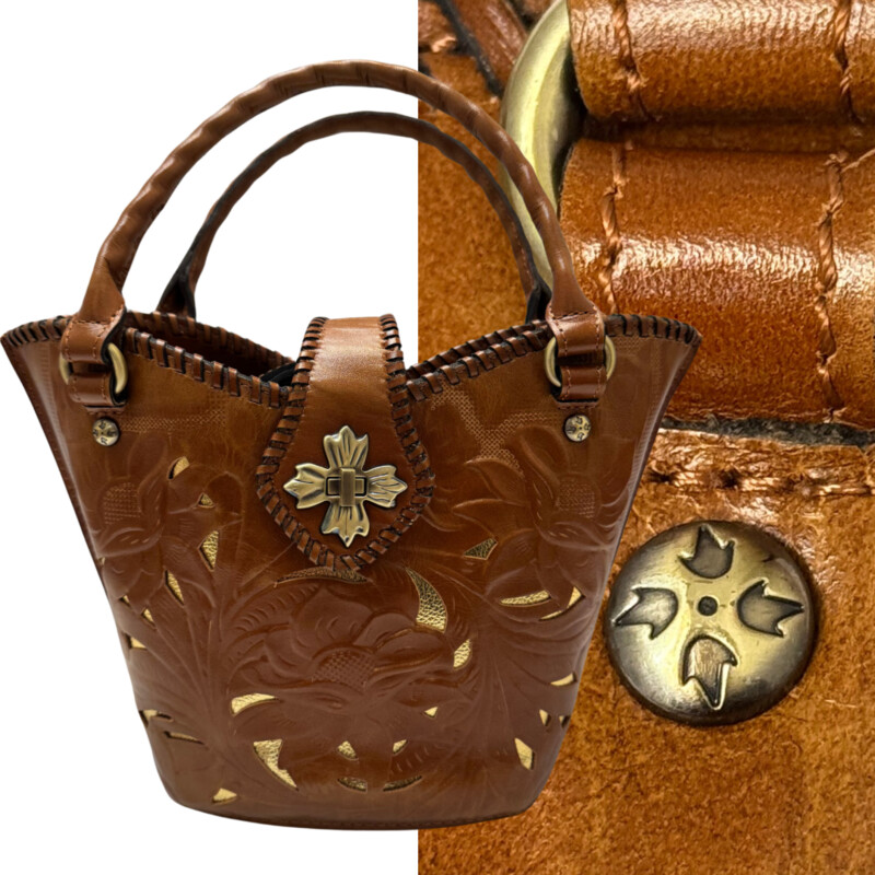 Patricia Nash Ninetta Handbag<br />
Tooled Leather<br />
Floral Detail<br />
Leather Whipstitching Trim<br />
Antiqued Gold Tone Hardware<br />
With Crossbody Strap<br />
Color: Camel