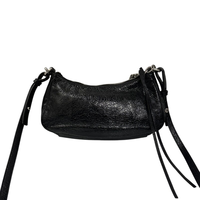 Balenciaga Le Cagole Mini Lambskin Crossbody<br />
<br />
Date Code 695814.1000 R527545<br />
<br />
Dimensions:<br />
<br />
8.2''W x 5.1''H x 1.7''D<br />
Shoulder chain strap with one hook, 15.7''<br />
Adjustable and removable crossbody strap, 40.5''<br />
<br />
Good condition. Interior stains.<br />
<br />
Comes with original dust bag. No box.