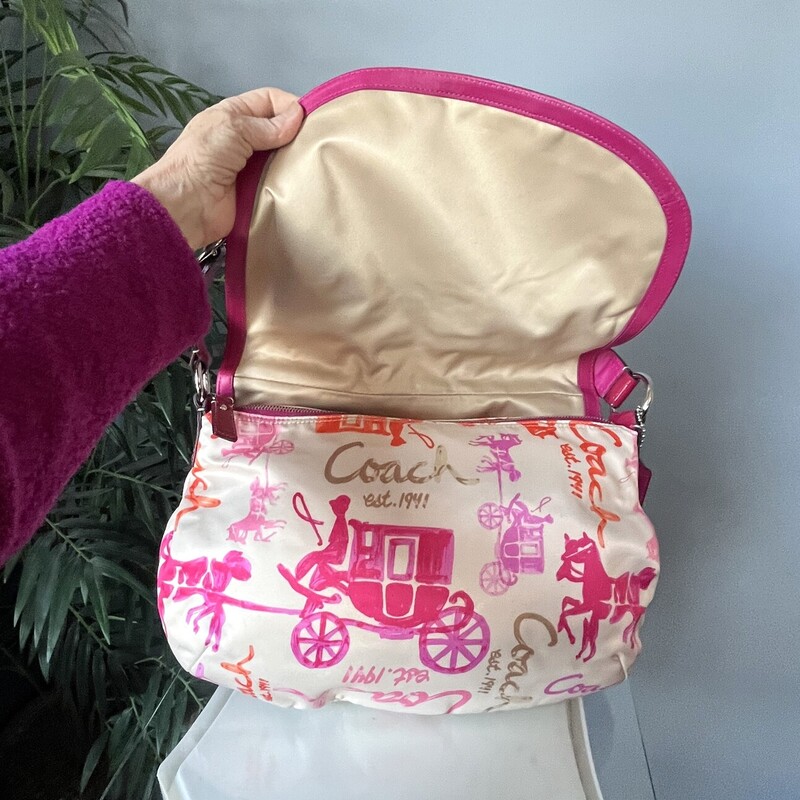 Coach Carriage Saddle, Pink, Size: None<br />
Coach Satchel from Y2K era<br />
Pink carriage print on waxed canvas with pink patent leather trim<br />
It  closes with a large flap and a top zipper<br />
Inside it has two slip pockets and one zippered pocket<br />
<br />
17 x 11.5 x aprox. 3.5<br />
Handle drop: 7.5 as shown and you can adjust it a little shorter if you like.<br />
Excellent condition, No flaws!<br />
thanks for for looking!<br />
#842420