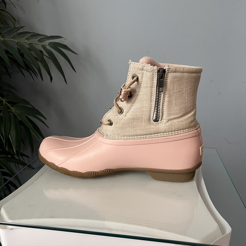 Brand new pair of adorable waterproof Duck Boots<br />
Pastel Pink and cream with laces and side zippers.<br />
These are Sperry Saltwater<br />
Size 9.5<br />
<br />
thanks for looking!<br />
#82447<br />
<br />
PLEASE NOTE - to save on shipping I will not be shipping these with the box.<br />
If you want the box pls get in touch before purchasing as the shipping cost will have to be adjusted.