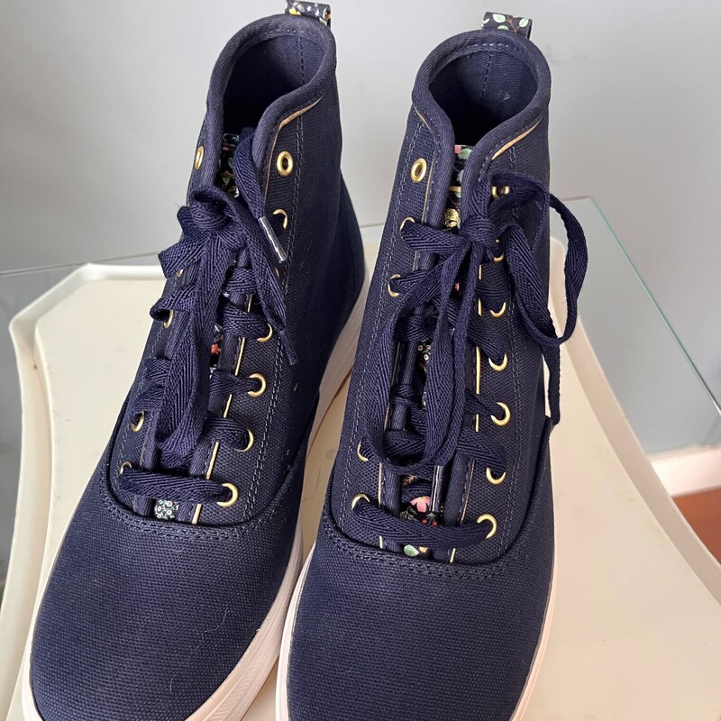 Irresistably pretty high top sneakers by keds, designed by the Rifle Paper Company.<br />
These are brand new.<br />
size 7<br />
They are sold out on the Keds Website.<br />
They have mid platforms and lug soles.<br />
Super wearable in Sold Navy Blue with floral accents<br />
If you would like me to ship them without the box for cheaper shipping, just let me know before you purchase and I'll adjust.<br />
<br />
thanks for looking!<br />
#82957