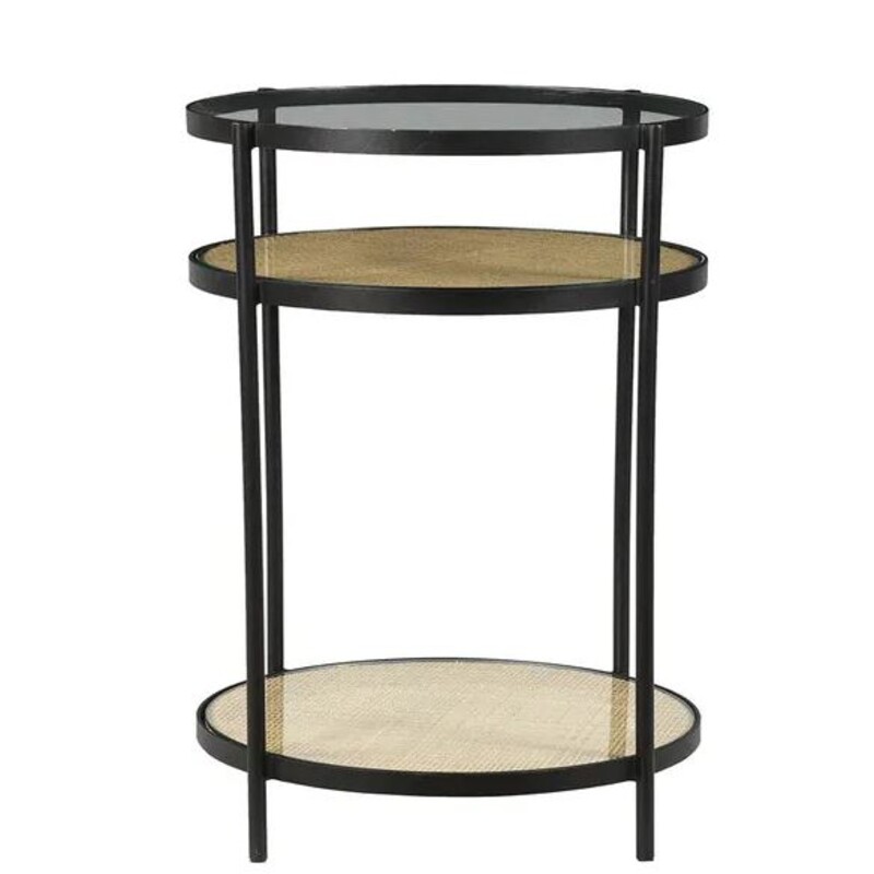 Mia Cane & Glass Side Accent Table
Black Clear Tan Size: 14 x 30H
BRAND NEW
Retails: $570+
Matching table and coffee table sold separately

The three-tier Mia Side Table offers a combination of storage and style. The round table has an iron framing that is finished in a contemporary and versatile black. The tabletop is made of smoky glass while the two lower shelves are covered in a tight, naturally hued rattan weave that creates a striking contrast to the bold frame.