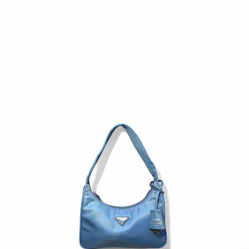 Prada ReEdition Nylon Blue Shoulder Bag

Factory Code: 270

Dimensions:
Base length: 9 in
Height: 6.75 in
Width: 2 in
Drop: 6 in

In excellent condtion.

Comes with original dust bag. No box.