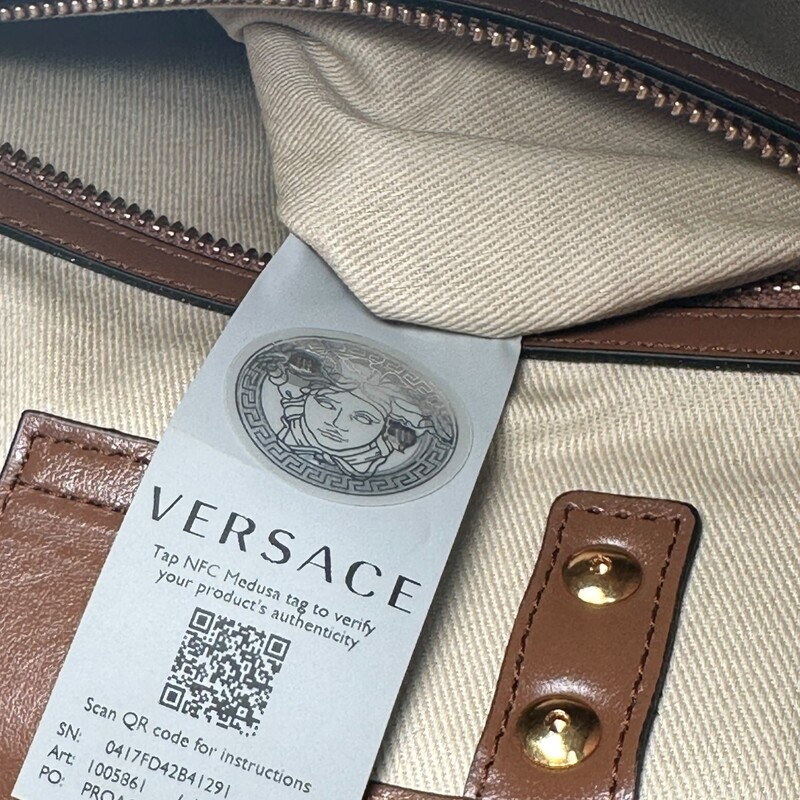 Versace La Medusa  All Over logo Brown Tote<br />
<br />
Dimensions:<br />
Height: 10<br />
Width: 11.5<br />
Depth: 4.75<br />
<br />
In excellent condition. Like new.<br />
<br />
Does not come with original dust bag or box.