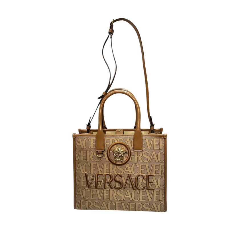 Versace La Medusa  All Over logo Brown Tote<br />
<br />
Dimensions:<br />
Height: 10<br />
Width: 11.5<br />
Depth: 4.75<br />
<br />
In excellent condition. Like new.<br />
<br />
Does not come with original dust bag or box.