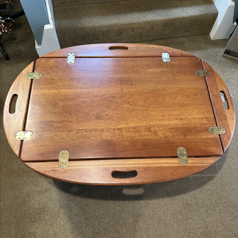 Butlers Coffee Table,<br />
Size: 42x30x18<br />
Hardwood table, custom made with beautiful brass<br />
hinges.  No scratches, excellent condition.